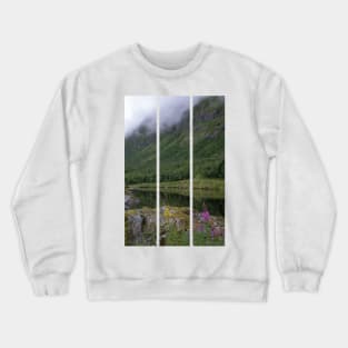 Wonderful landscapes in Norway. Senja, Nordland. Beautiful scenery of a valley with lupine flowers on the rocks. Mirror in the lake. Cloudy summer day. Fog and mountains in background (vertical) Crewneck Sweatshirt